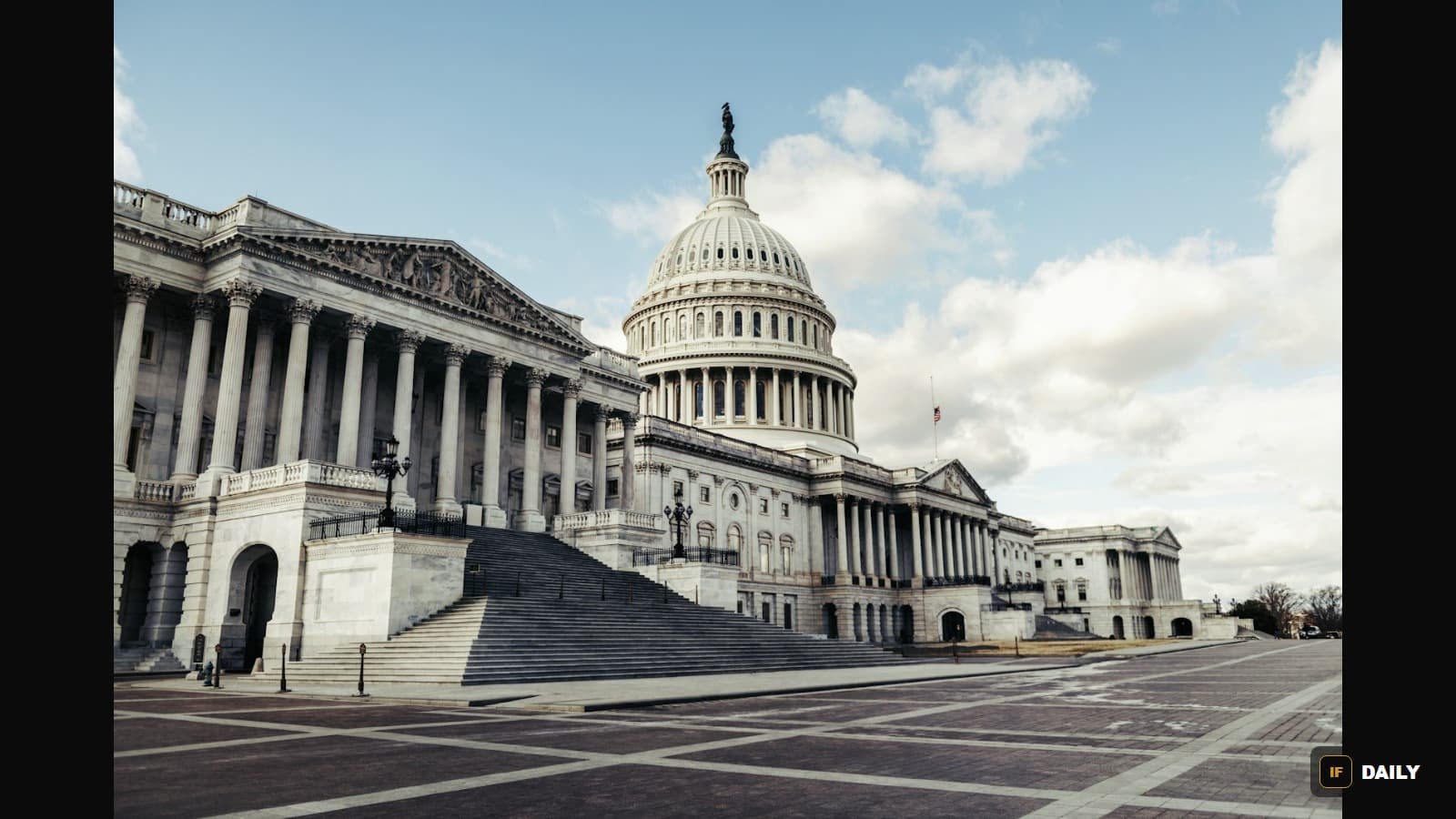 The United States Capitol building viewed from below, with its white dome against a blue sky
